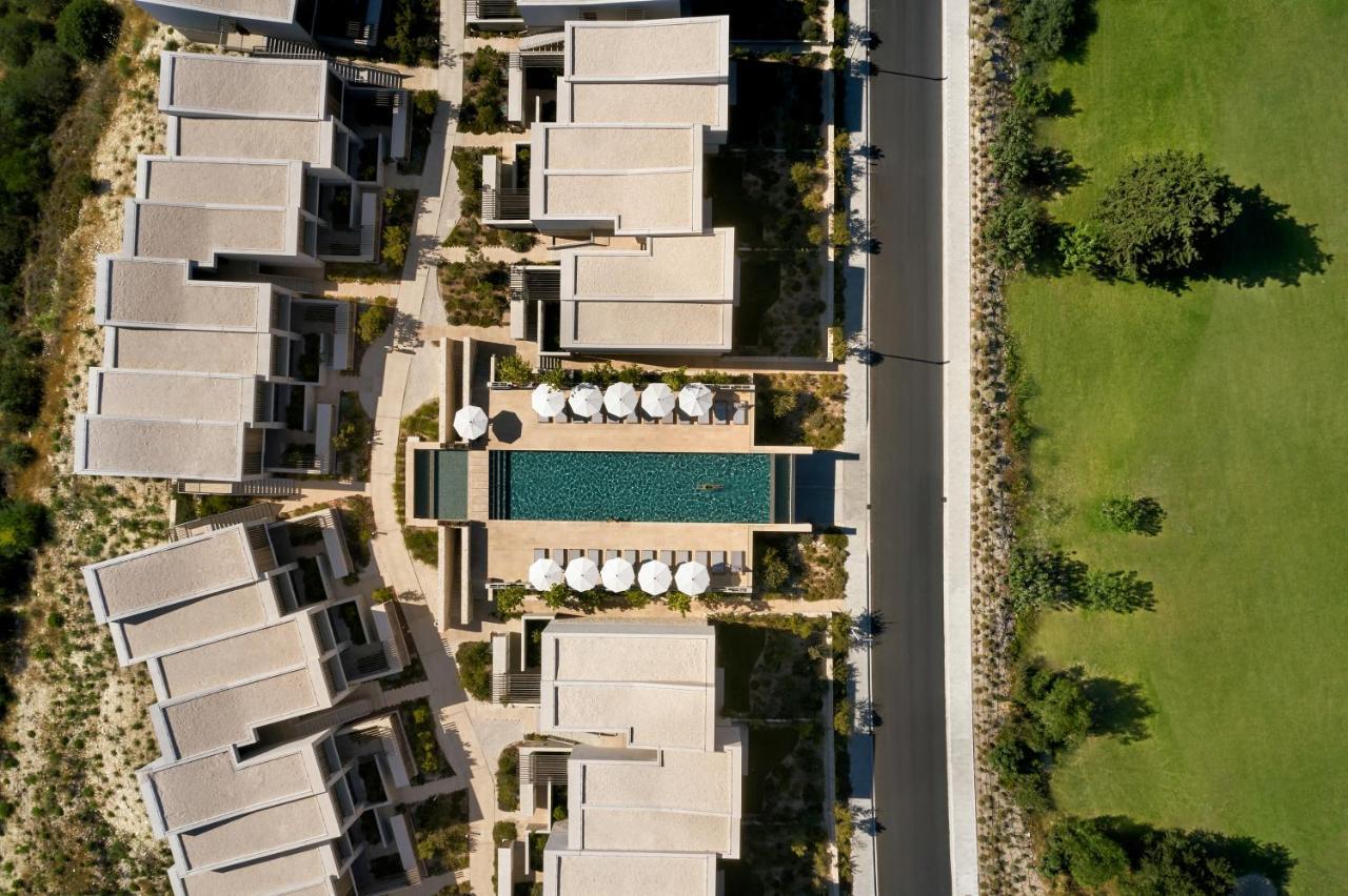 Minthis Resort Tsadha Екстериор снимка Aerial view of the hotel